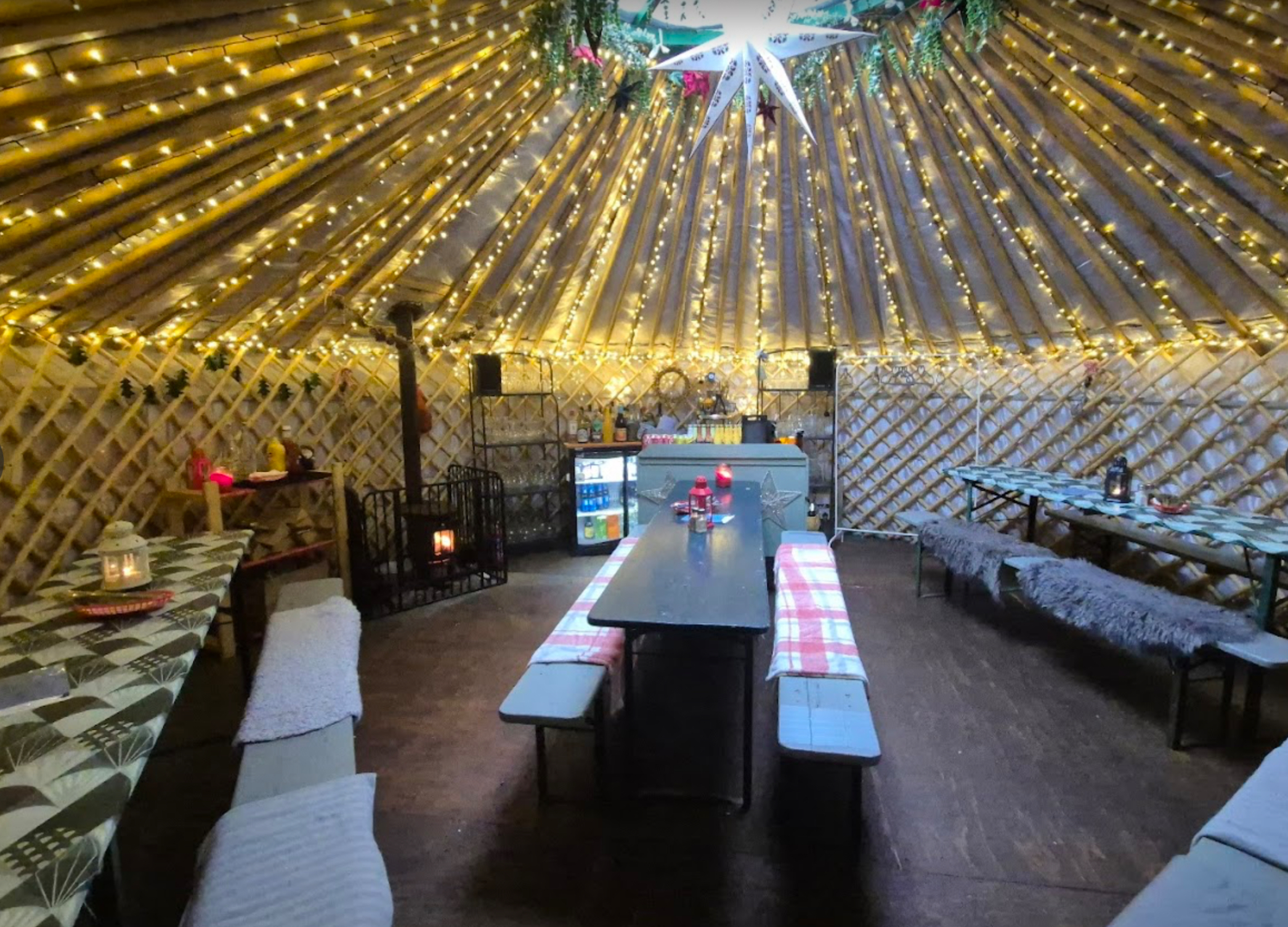 Insulated restaurant garden yurt interior with fairy lights - Free State Kitchen Yurt