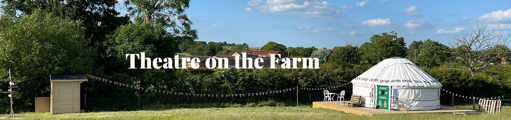 Official Theatre on the Farm panoramic banner featuring a yurt in a meadow